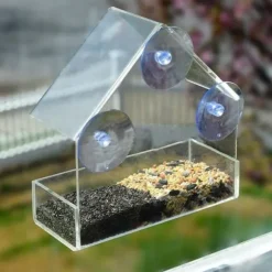 Fågelmatare i transparent husdesign för fönster - med väderskydd